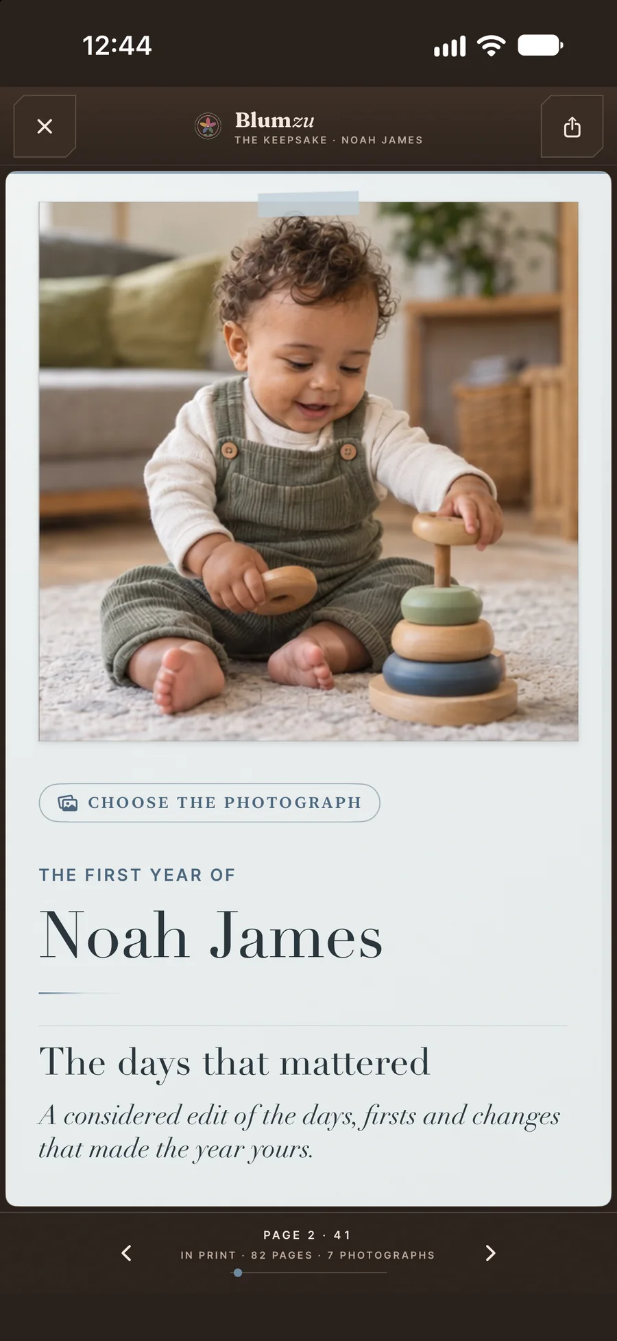 Inside the digital Blumzu book: a full-page photograph of Noah James playing with stacking rings.